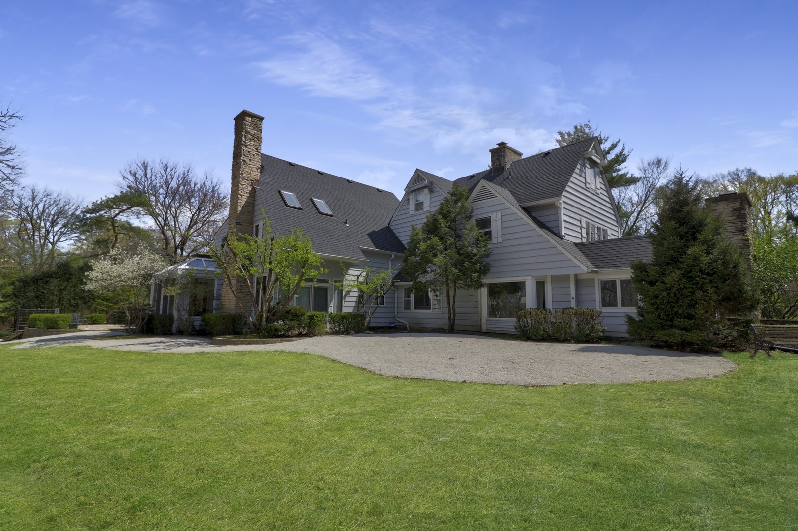 3423 Spring Road Oak Brook, IL 60523 - Photo 58 of 75 a front view of a house with a yard and palm trees