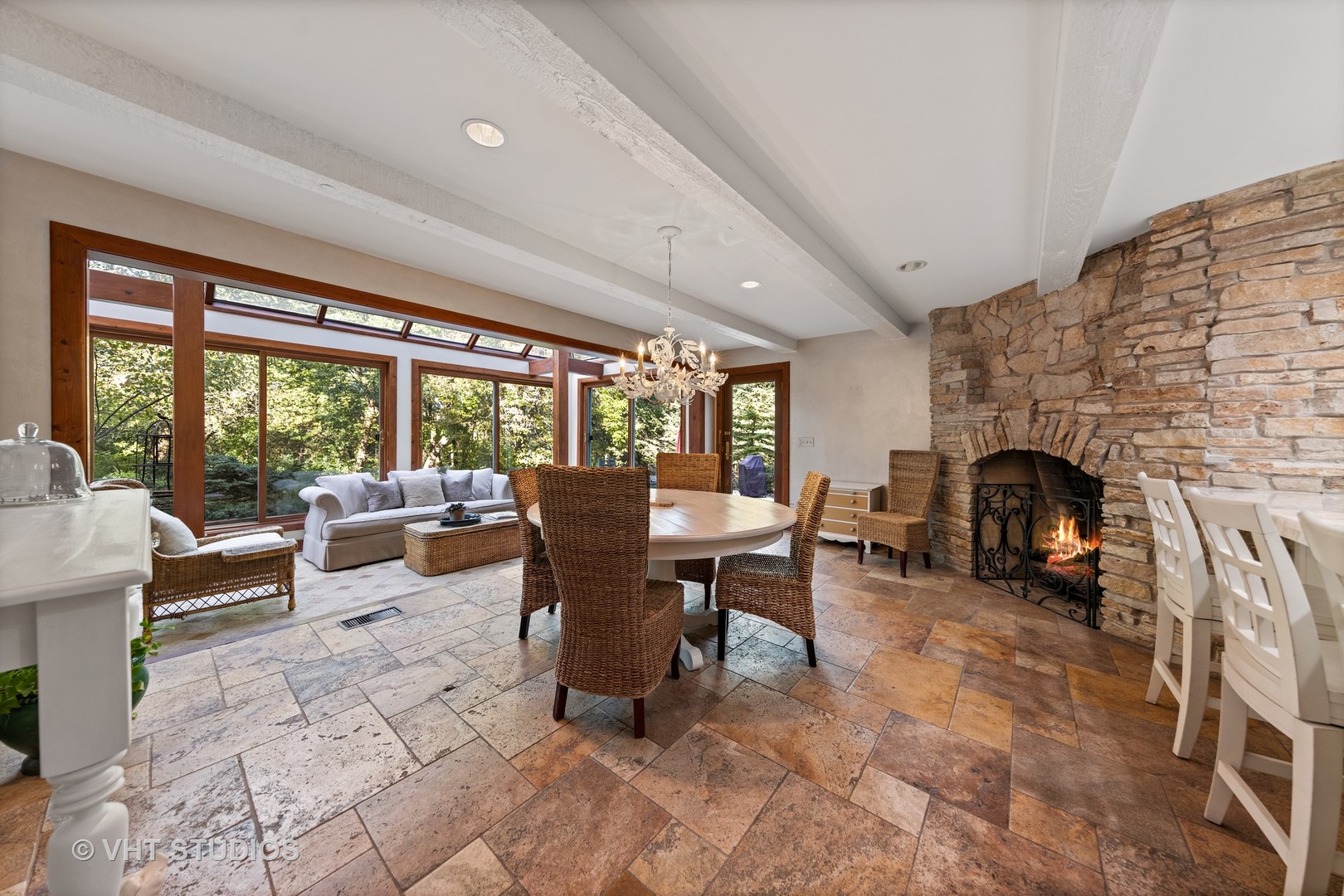 3423 Spring Road Oak Brook, IL 60523 - Photo 6 of 75 a living room with furniture a fireplace and a floor to ceiling window