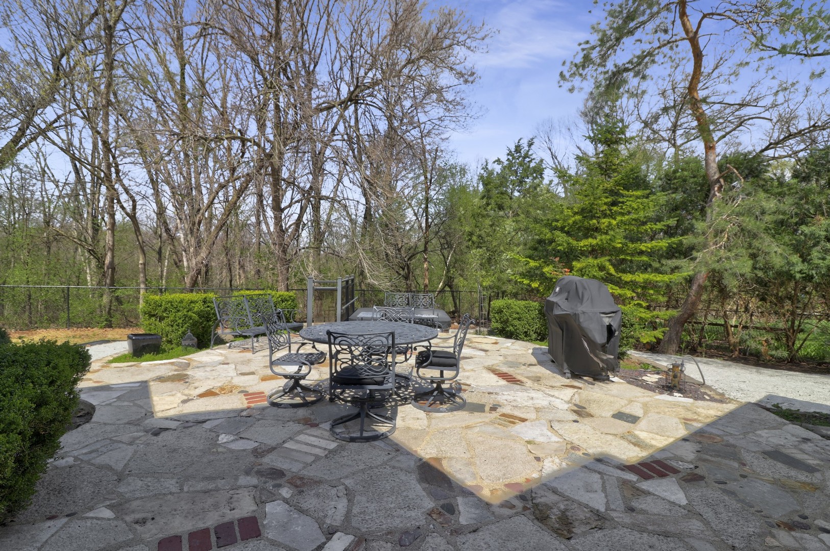 3423 Spring Road Oak Brook, IL 60523 - Photo 66 of 75 a view of a bench on a sidewalk