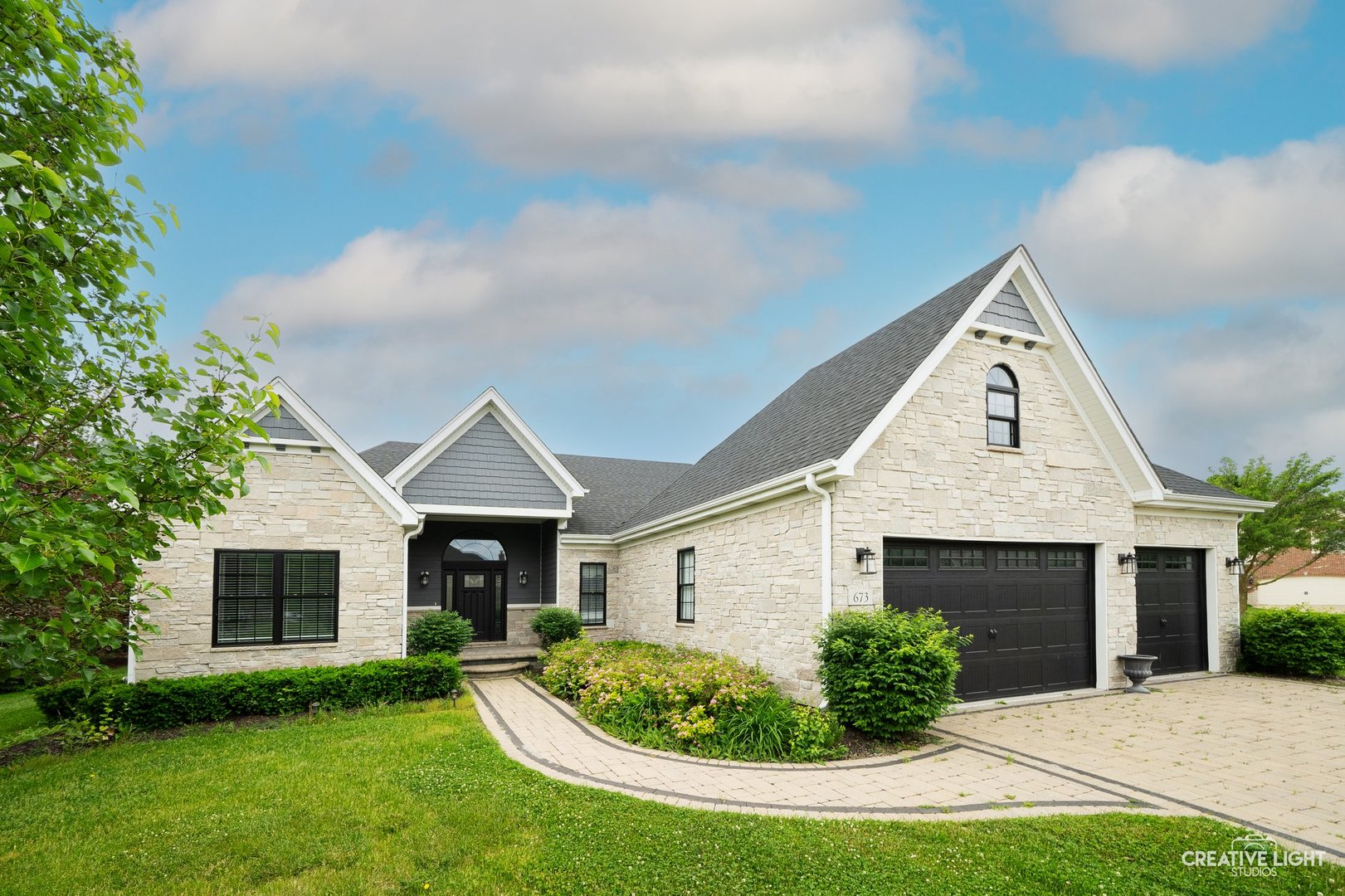 673 Greenfield Road Sugar Grove, IL 60554 - Photo 2 of 31 a front view of a house with a yard and garage
