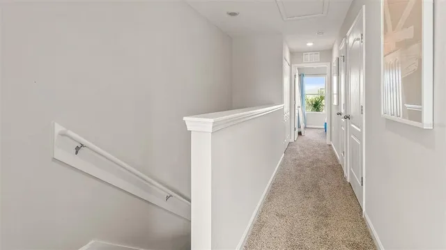 a view of a hallway with white walls