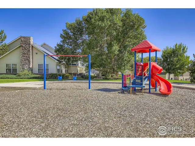 a view of a swimming pool with an outdoor space and seating area