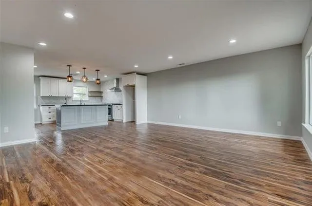 a view of kitchen with wooden floor
