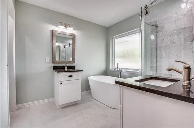 a bathroom with a sink a toilet and a bathtub