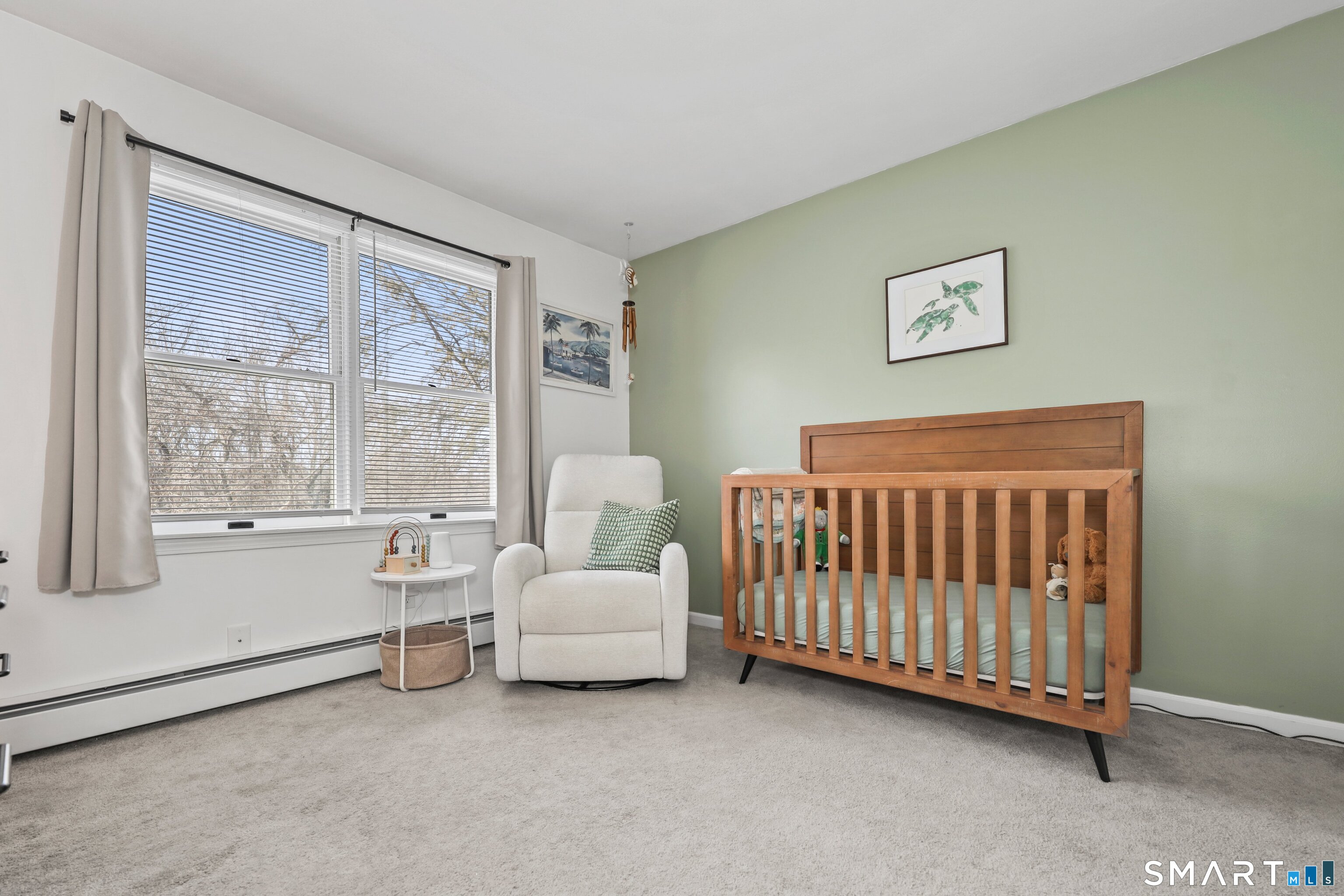 29 Toas Street, Unit 29 Shelton, CT 06484 - Photo 15 of 31 a view of a bedroom with furniture and windows