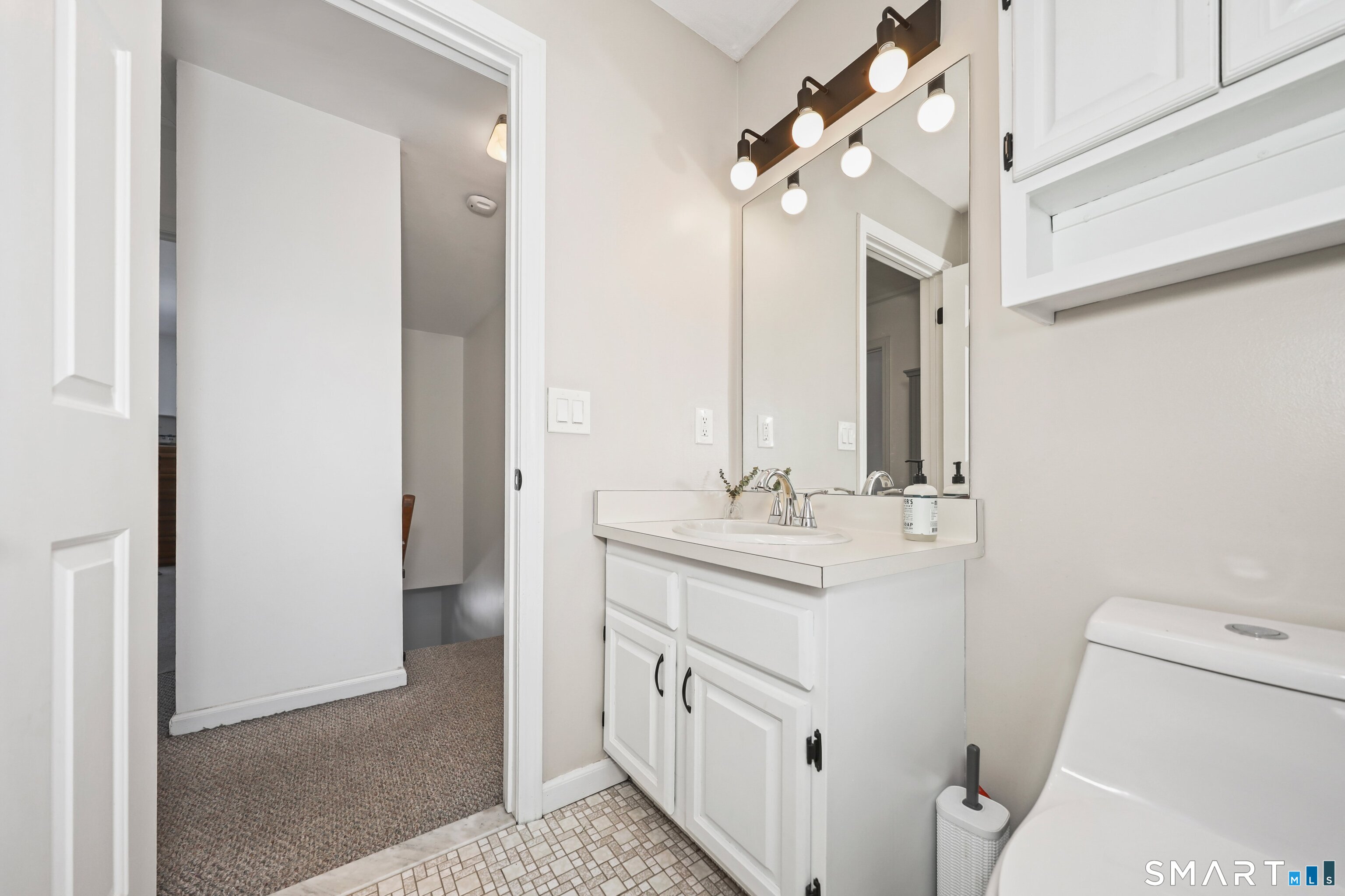 29 Toas Street, Unit 29 Shelton, CT 06484 - Photo 19 of 31 a bathroom with 2 sink and a toilet