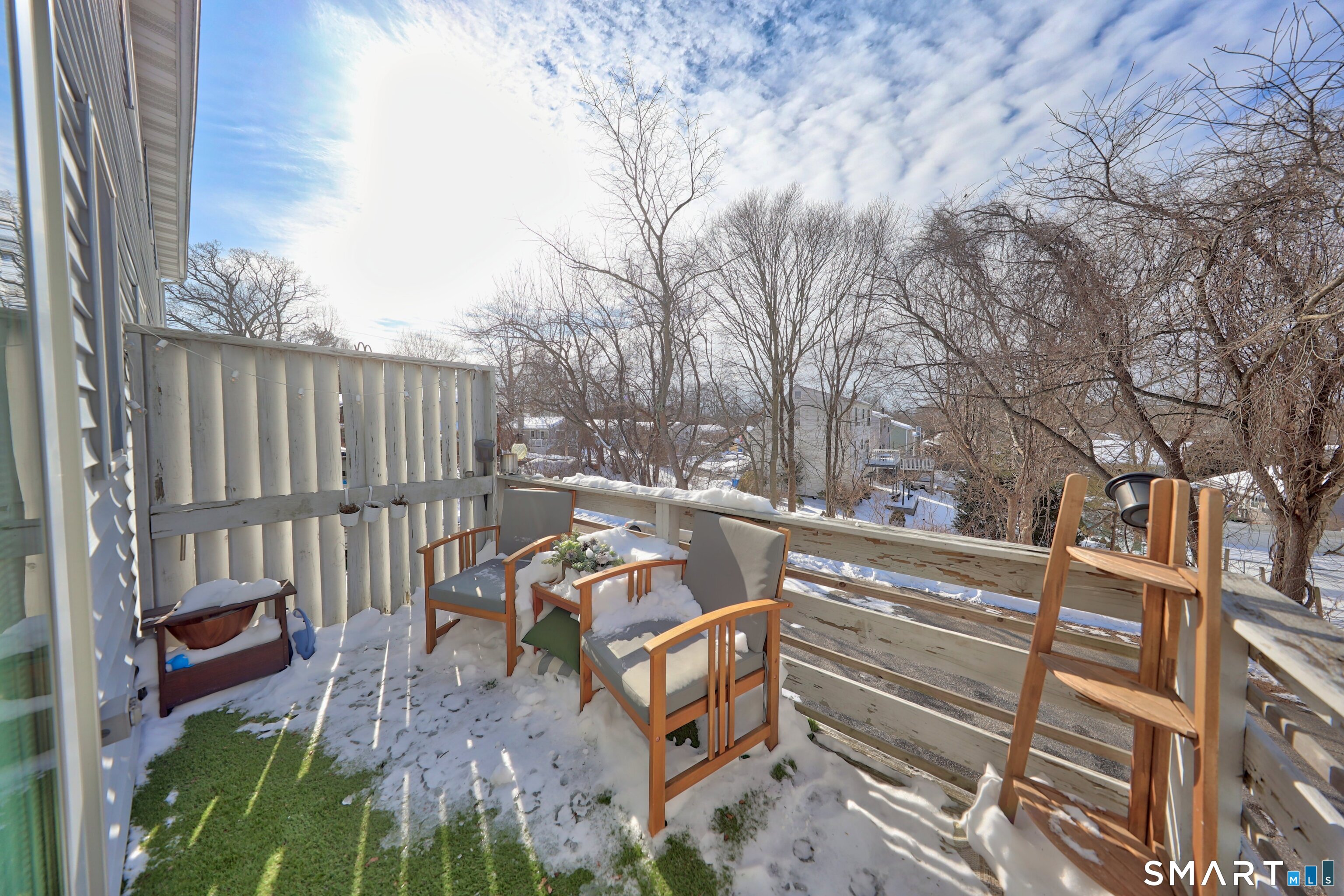 29 Toas Street, Unit 29 Shelton, CT 06484 - Photo 24 of 31 a view of a backyard with a large tree and wooden fence