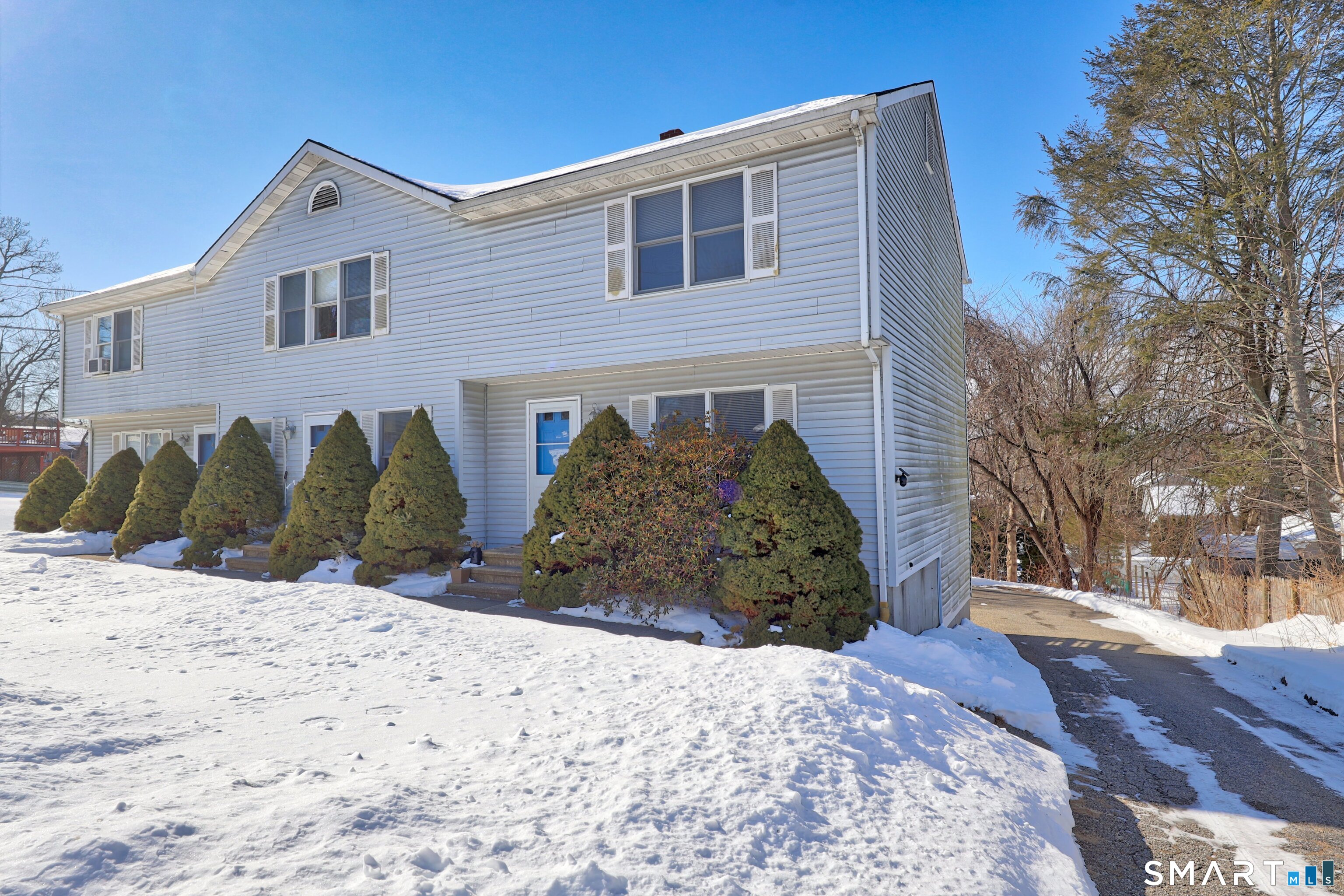 29 Toas Street, Unit 29 Shelton, CT 06484 - Photo 25 of 31 a front view of a house with a yard