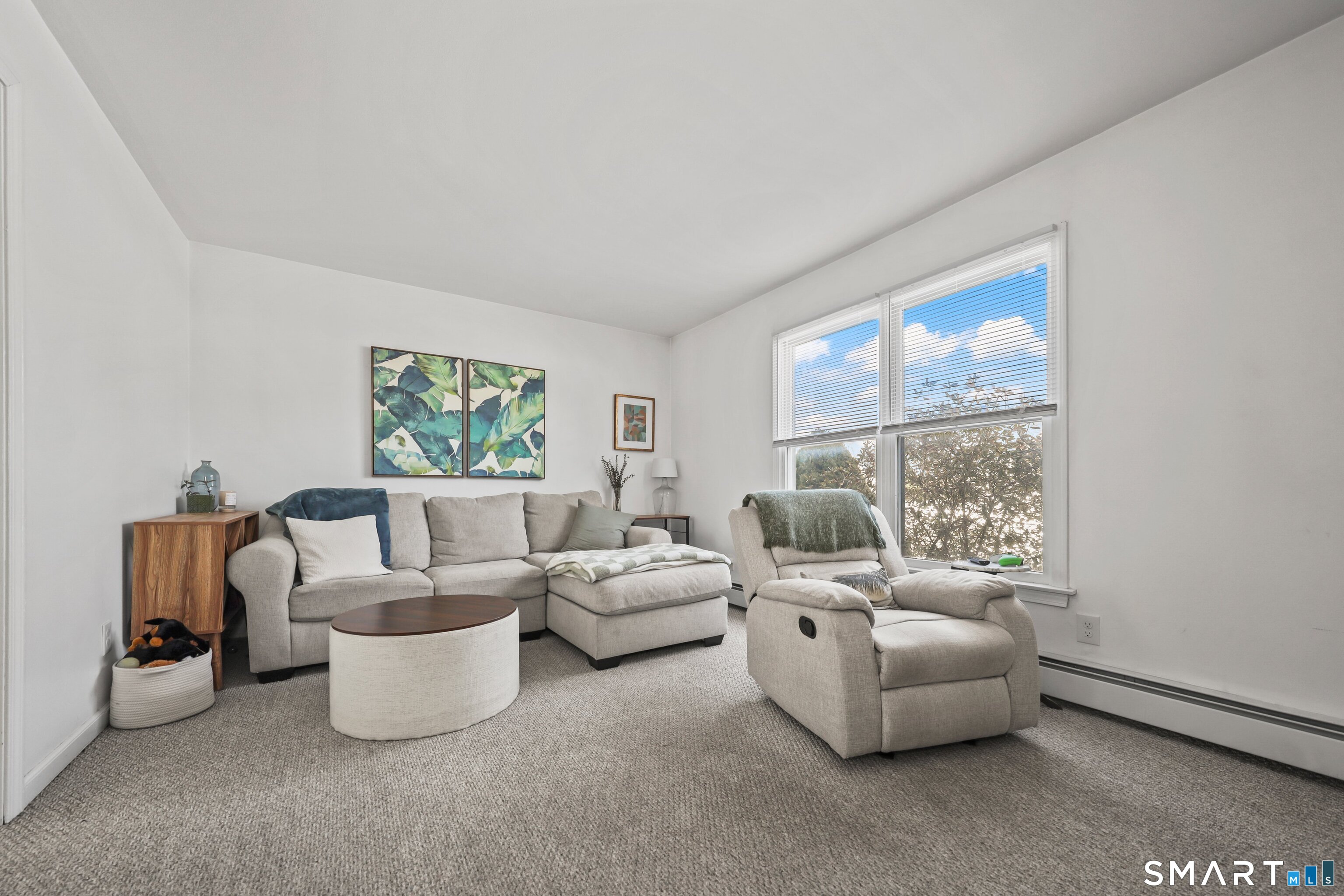 29 Toas Street, Unit 29 Shelton, CT 06484 - Photo 4 of 31 a living room with furniture and a window