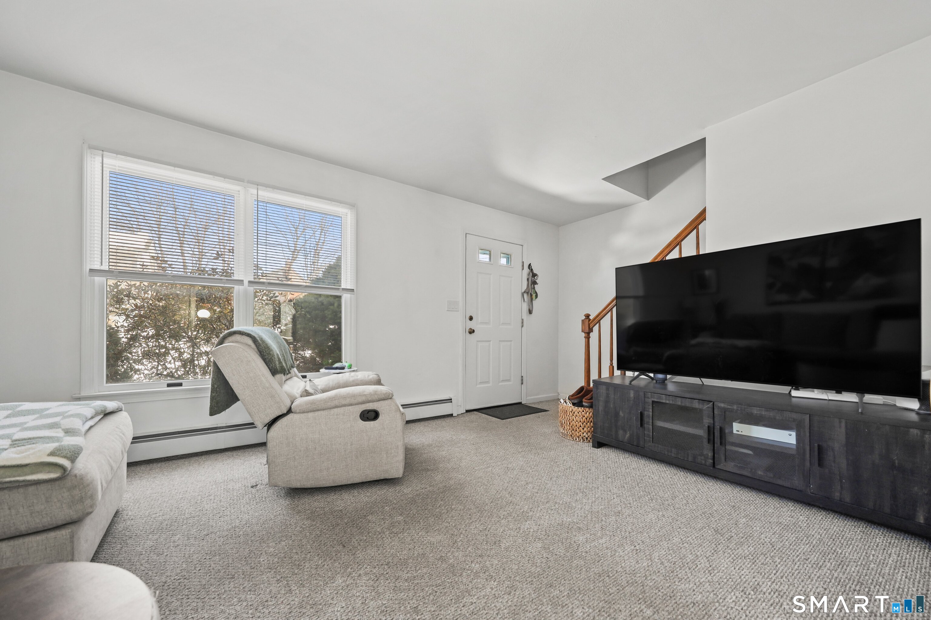 29 Toas Street, Unit 29 Shelton, CT 06484 - Photo 5 of 31 a living room with furniture and a flat screen tv