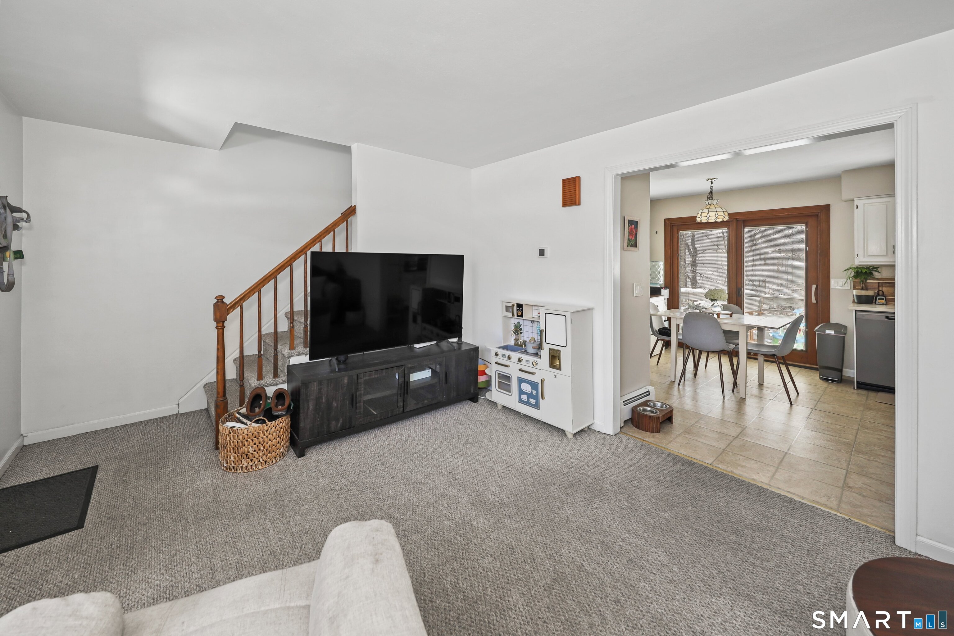 29 Toas Street, Unit 29 Shelton, CT 06484 - Photo 6 of 31 a living room with furniture and a flat screen tv