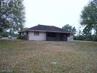 10760 Ruden Road North Fort Myers, FL 33917 - Photo 1 of 9 a front view of a house with a garden