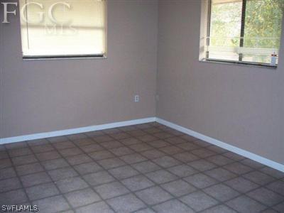 10760 Ruden Road North Fort Myers, FL 33917 - Photo 3 of 9 an empty room with a window