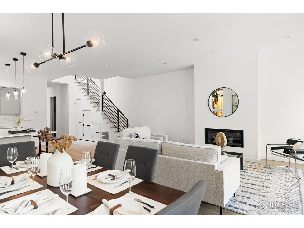 3315 Broadway Boulder, CO 80304 - Photo 5 of 42 a living room with lots of furniture and a clock