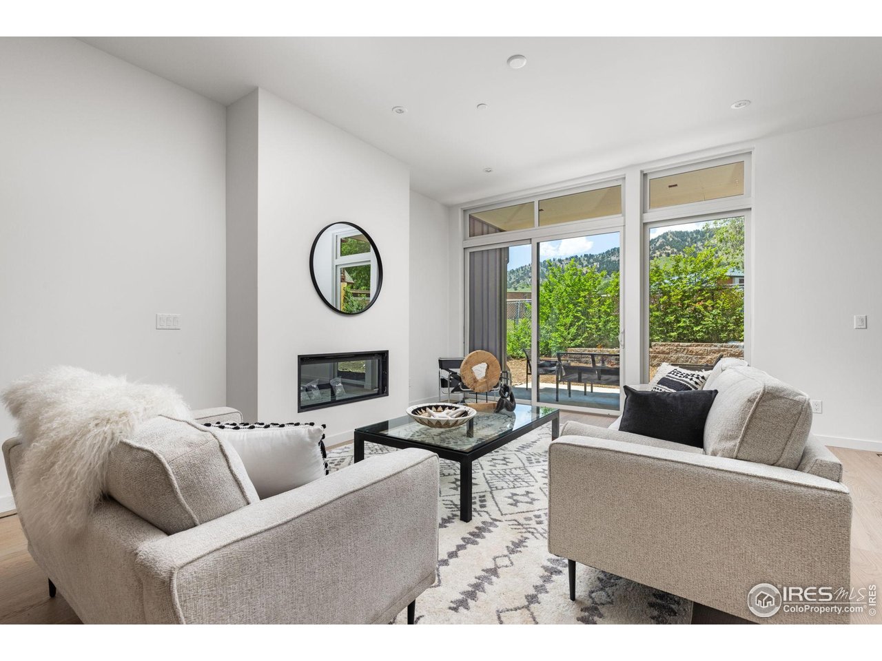 3315 Broadway Boulder, CO 80304 - Photo 6 of 42 a living room with furniture and a large window