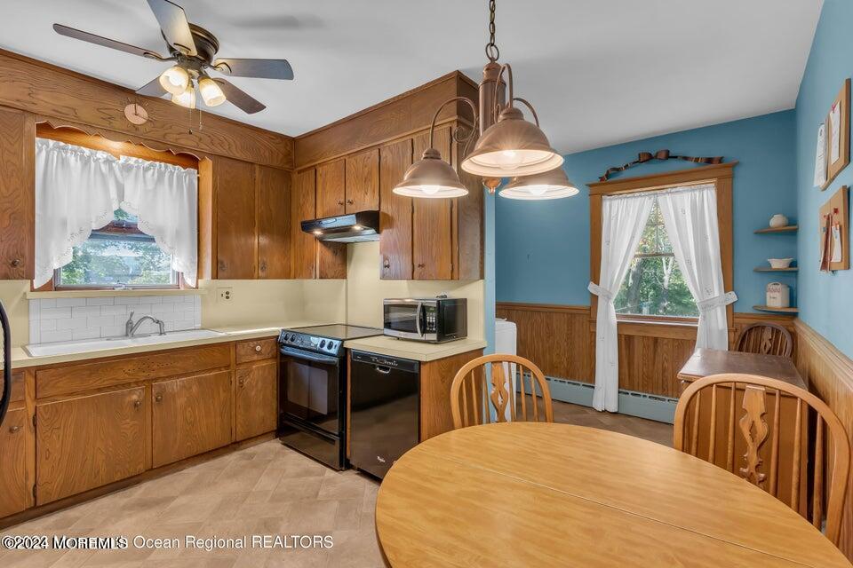 649 McClellan Street Long Branch, NJ 07740 - Photo 13 of 33 a kitchen with stainless steel appliances granite countertop a sink stove and refrigerator