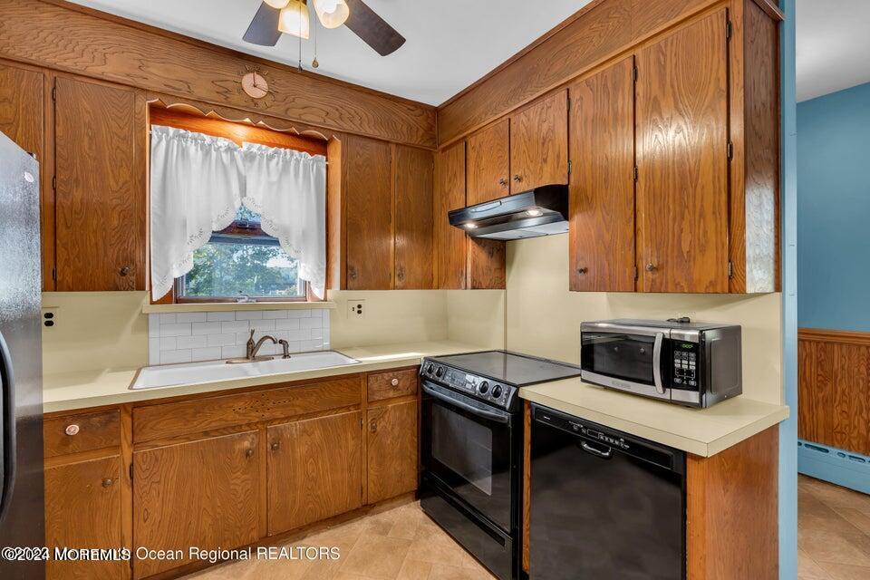 649 McClellan Street Long Branch, NJ 07740 - Photo 14 of 33 a kitchen with stainless steel appliances granite countertop a sink stove and refrigerator