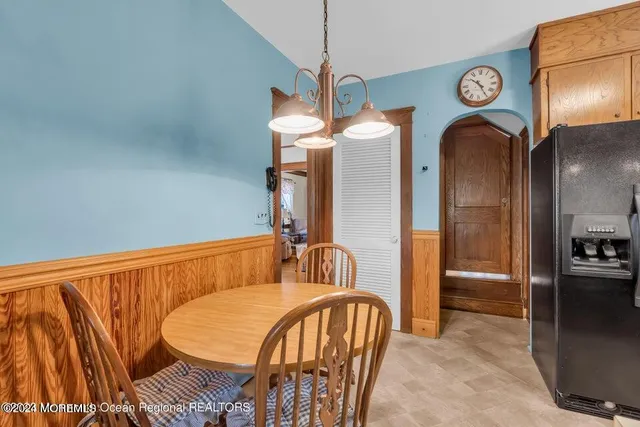 a bedroom with a bed and ceiling fan