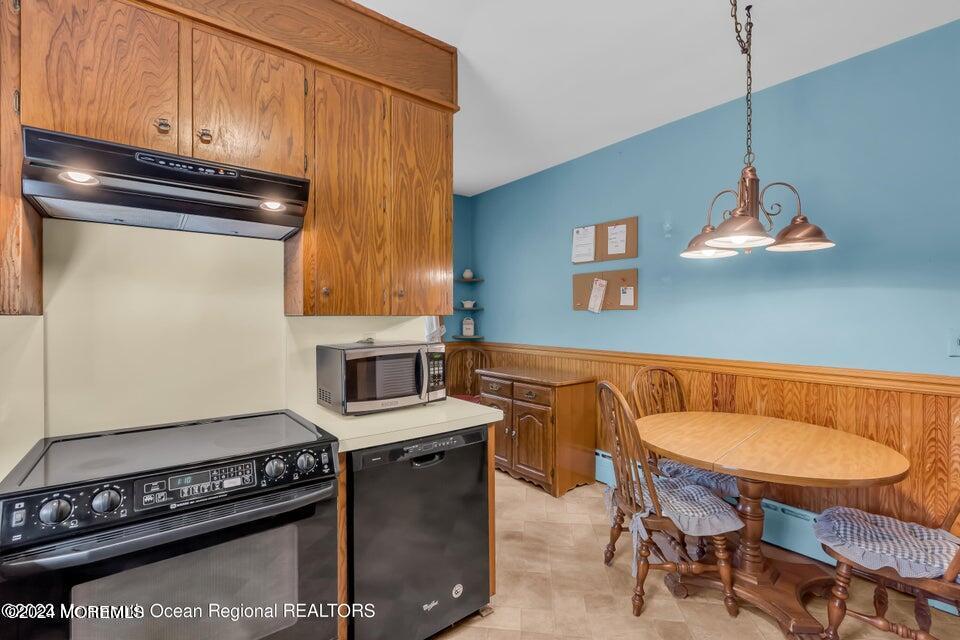 649 McClellan Street Long Branch, NJ 07740 - Photo 17 of 33 a kitchen with stainless steel appliances granite countertop a stove a sink and a microwave