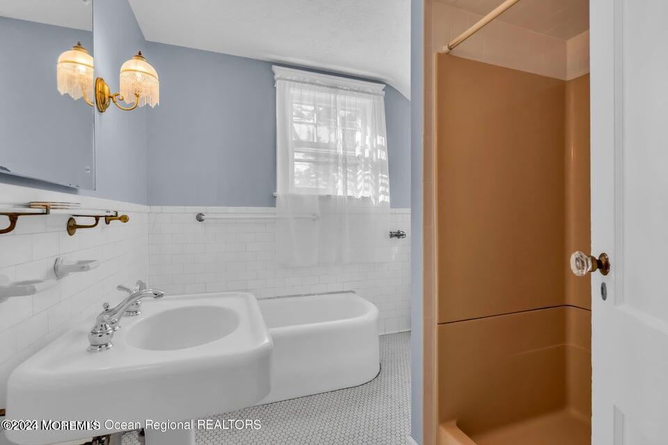 649 McClellan Street Long Branch, NJ 07740 - Photo 27 of 33 a bathroom with a sink a window and a mirror