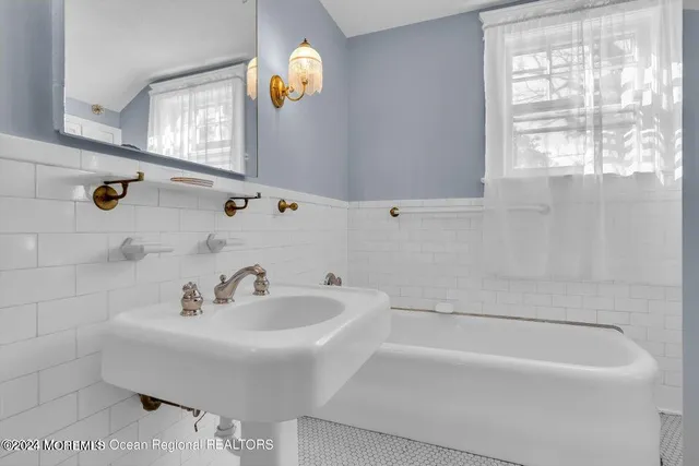 a bathroom with a sink and a bathtub