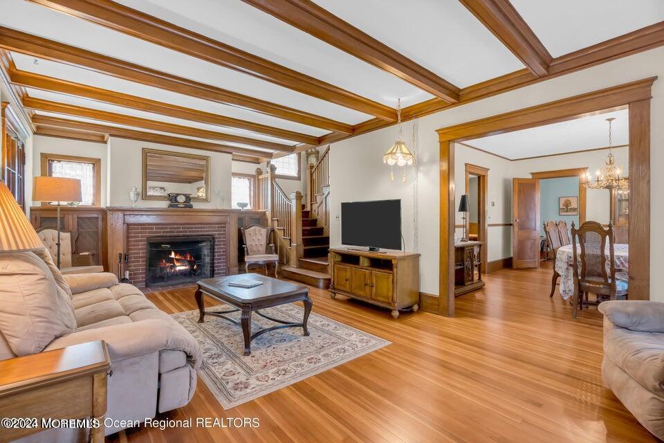 649 McClellan Street Long Branch, NJ 07740 - Photo 5 of 33 a living room with furniture a fireplace and a flat screen tv