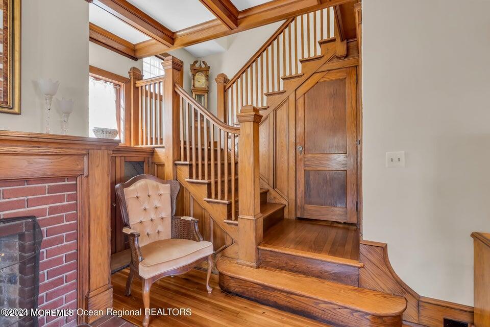 649 McClellan Street Long Branch, NJ 07740 - Photo 9 of 33 a view of staircase with wooden floor and a rug