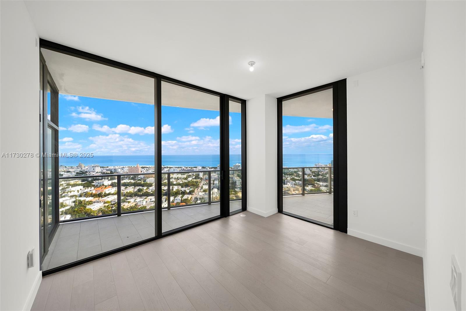 500 Alton Road, Unit 3101 Miami Beach, FL 33139 - Photo 15 of 53 a view of an empty room with windows with view of balcony