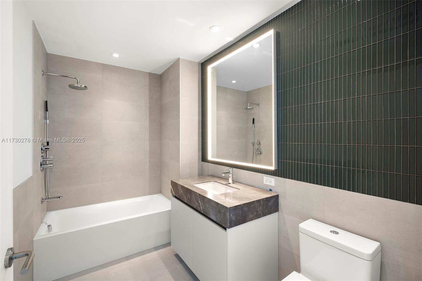 500 Alton Road, Unit 3101 Miami Beach, FL 33139 - Photo 16 of 53 a bathroom with a sink a toilet and bathtub