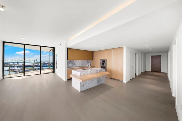 an empty room with large window