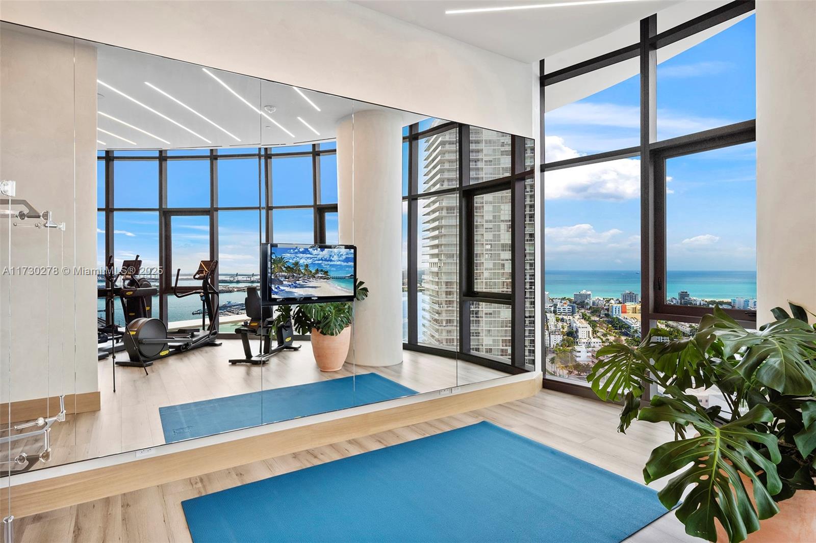 500 Alton Road, Unit 3101 Miami Beach, FL 33139 - Photo 31 of 53 a living room filled with furniture and a potted plant