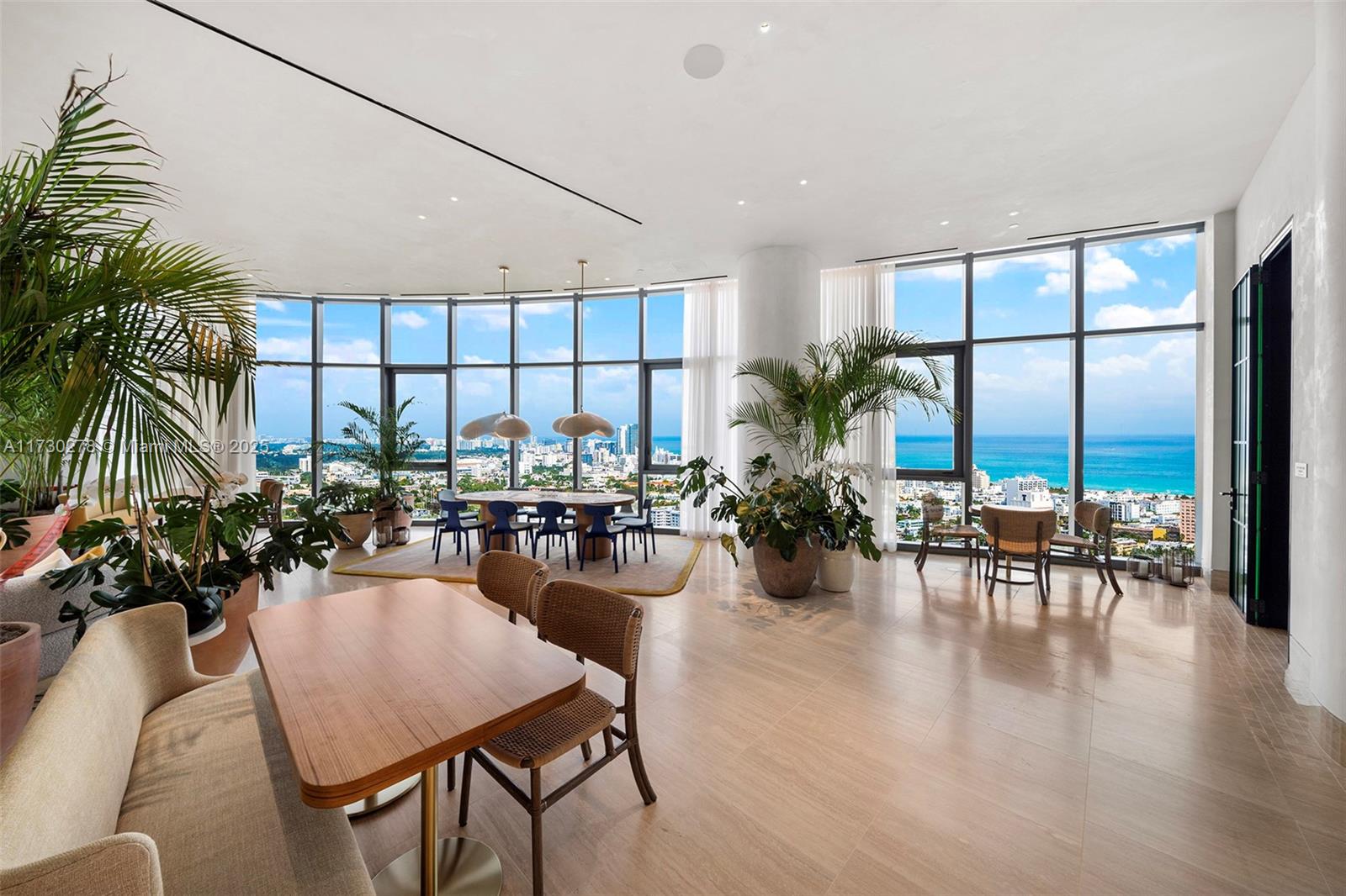 500 Alton Road, Unit 3101 Miami Beach, FL 33139 - Photo 40 of 53 a view of a dining room with furniture window and wooden floor