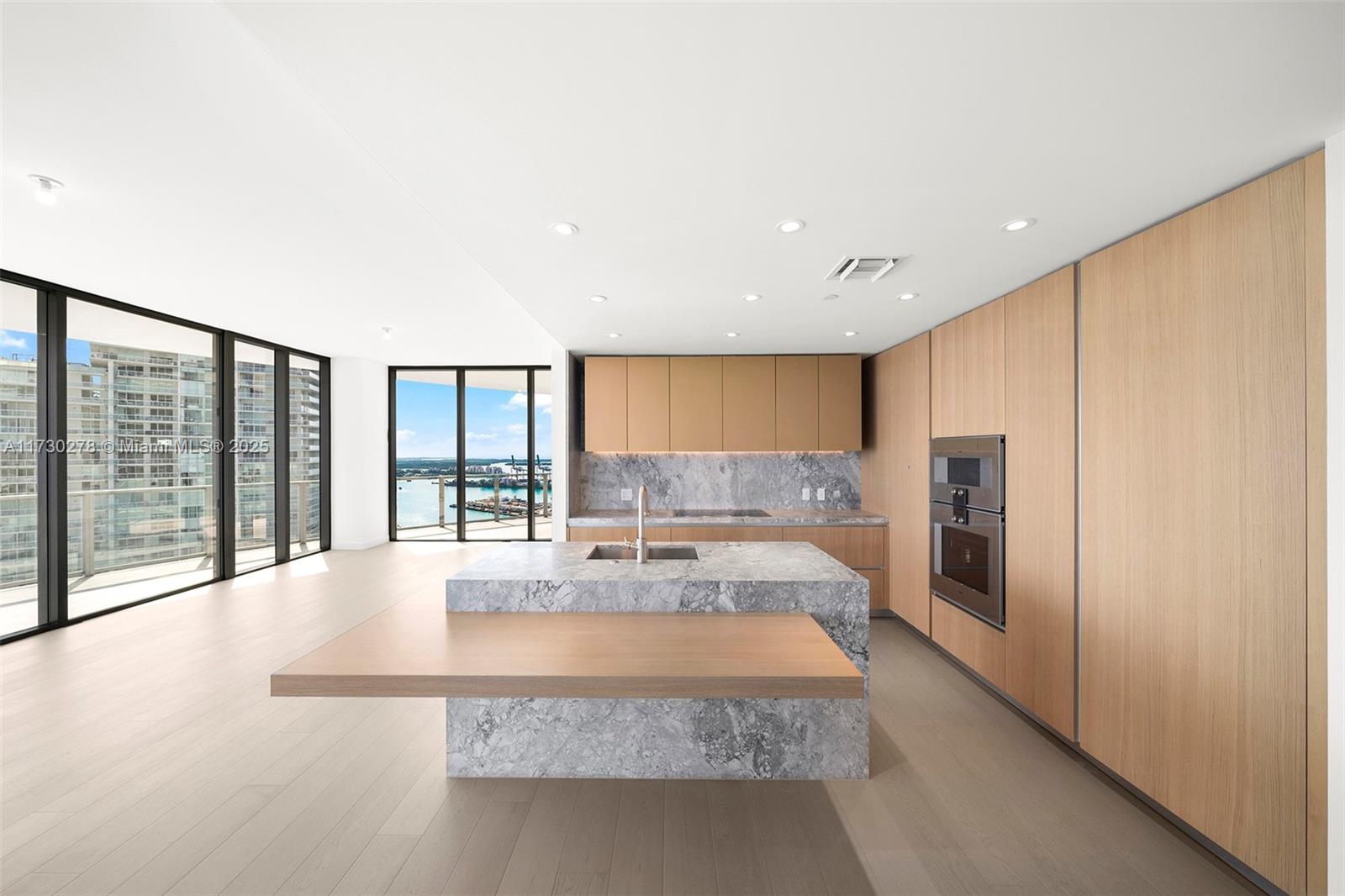 500 Alton Road, Unit 3101 Miami Beach, FL 33139 - Photo 4 of 53 a large white kitchen with a large window