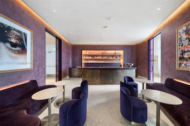 a kitchen with a table and chairs