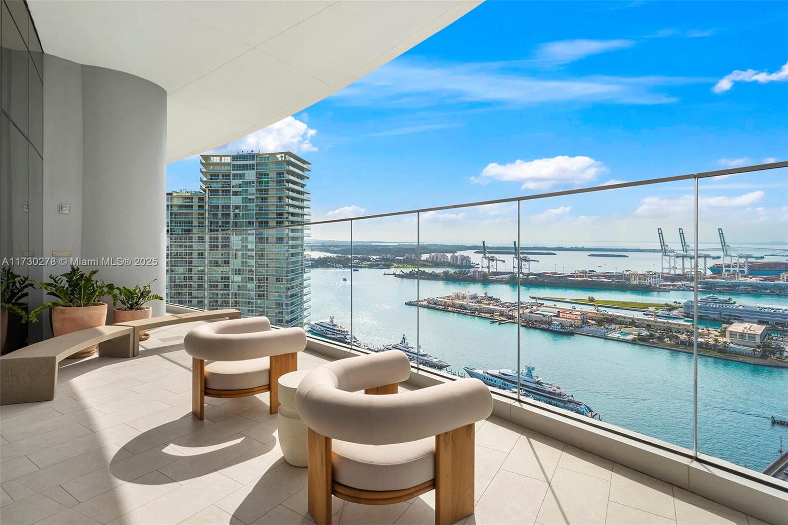 500 Alton Road, Unit 3101 Miami Beach, FL 33139 - Photo 45 of 53 a kitchen with a table and chairs
