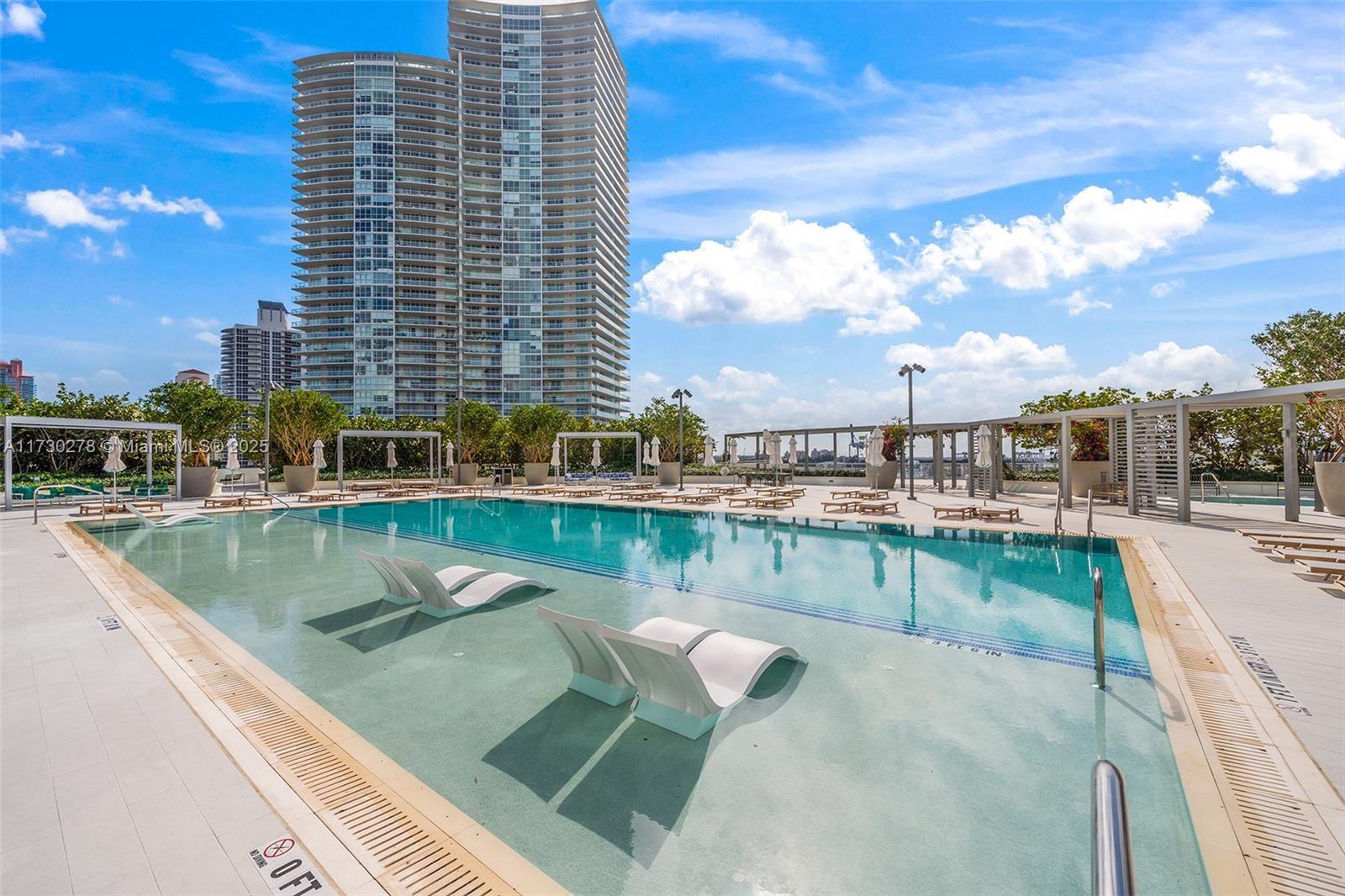 500 Alton Road, Unit 3101 Miami Beach, FL 33139 - Photo 46 of 53 a view of swimming pool from a balcony