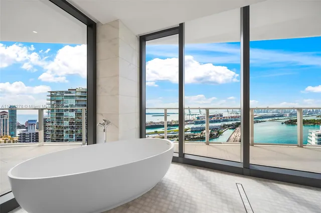 a bathroom with a glass shower door