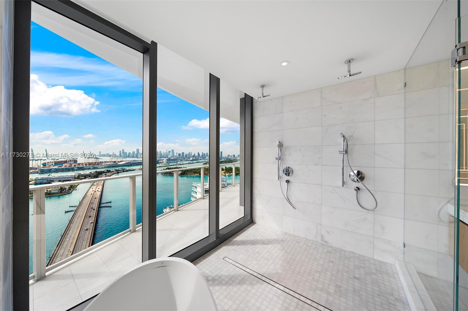 500 Alton Road, Unit 3101 Miami Beach, FL 33139 - Photo 10 of 53 a bathroom with a glass shower door