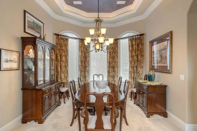 a bedroom with furniture and a lamp