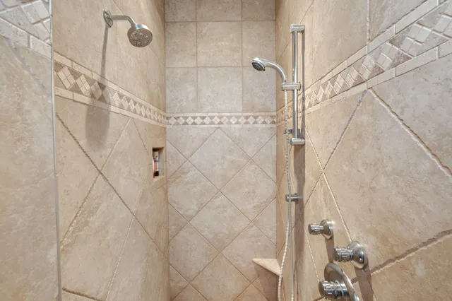 a living room with furniture a ceiling fan and a window