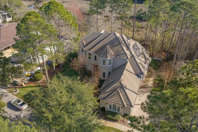 an aerial view of a house with a yard