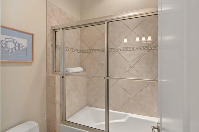 a view of balcony with wooden floor and outdoor seating