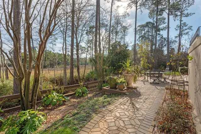 an aerial view of residential building and trees around