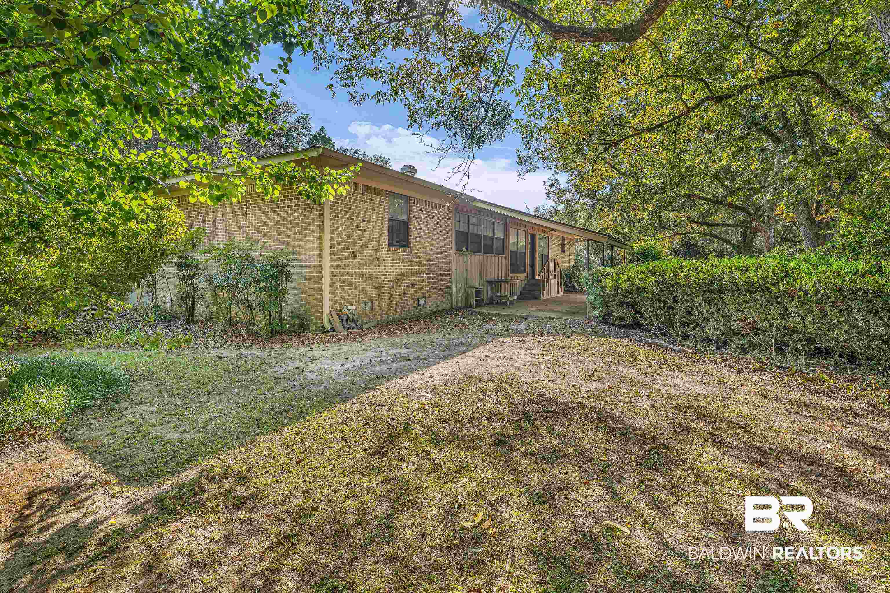 72075 Highway 59 Little River, AL 36550 - Photo 5 of 40 Rear view of property with crawl space, brick siding, and a lawn