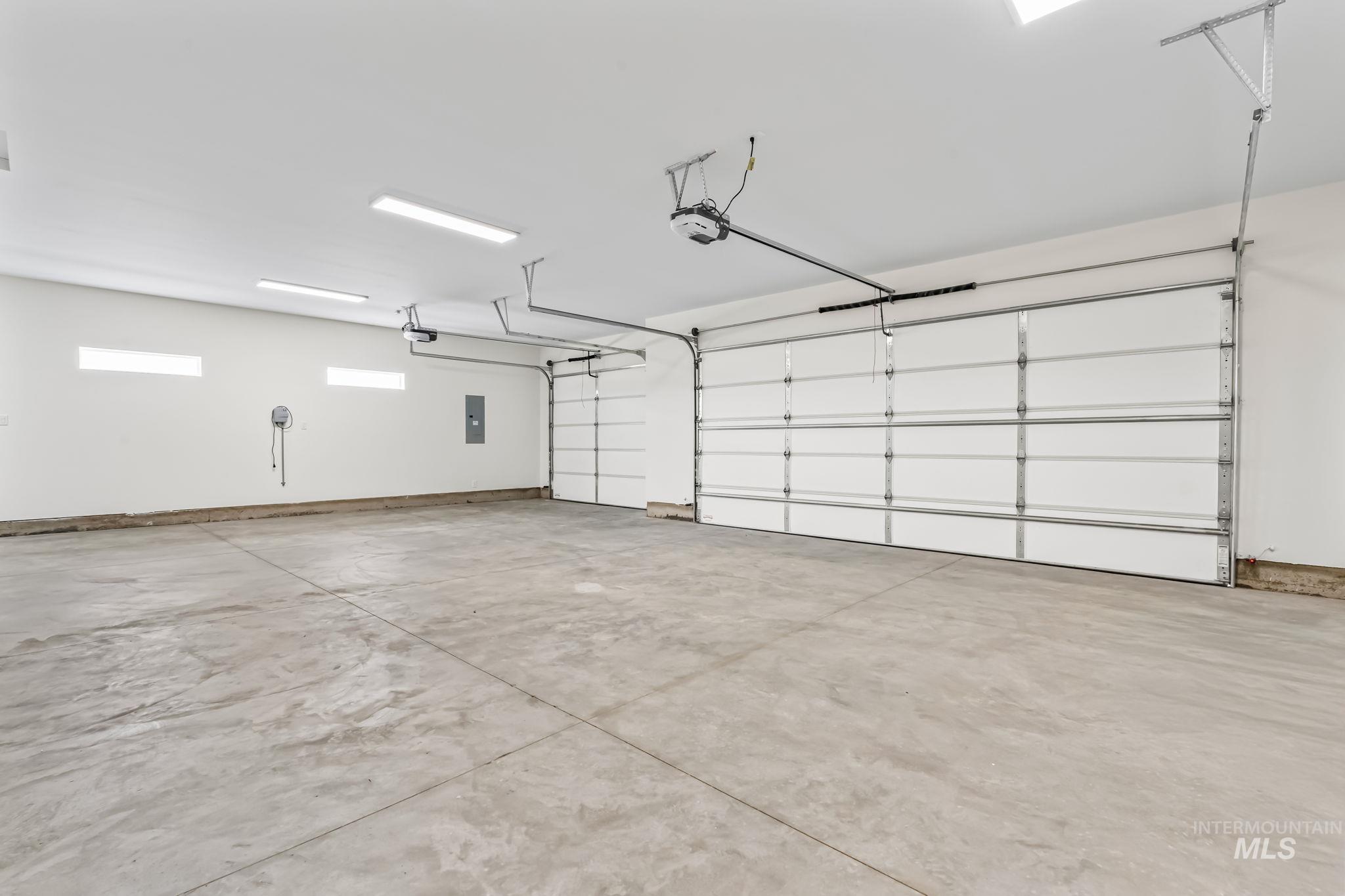 2755 Cypress Point Payette, ID 83661 - Photo 23 of 28 Garage featuring electric panel and a garage door opener