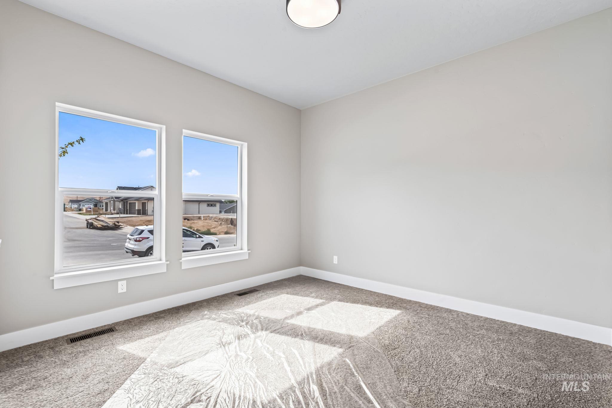 2755 Cypress Point Payette, ID 83661 - Photo 26 of 28 Carpeted empty room featuring baseboards