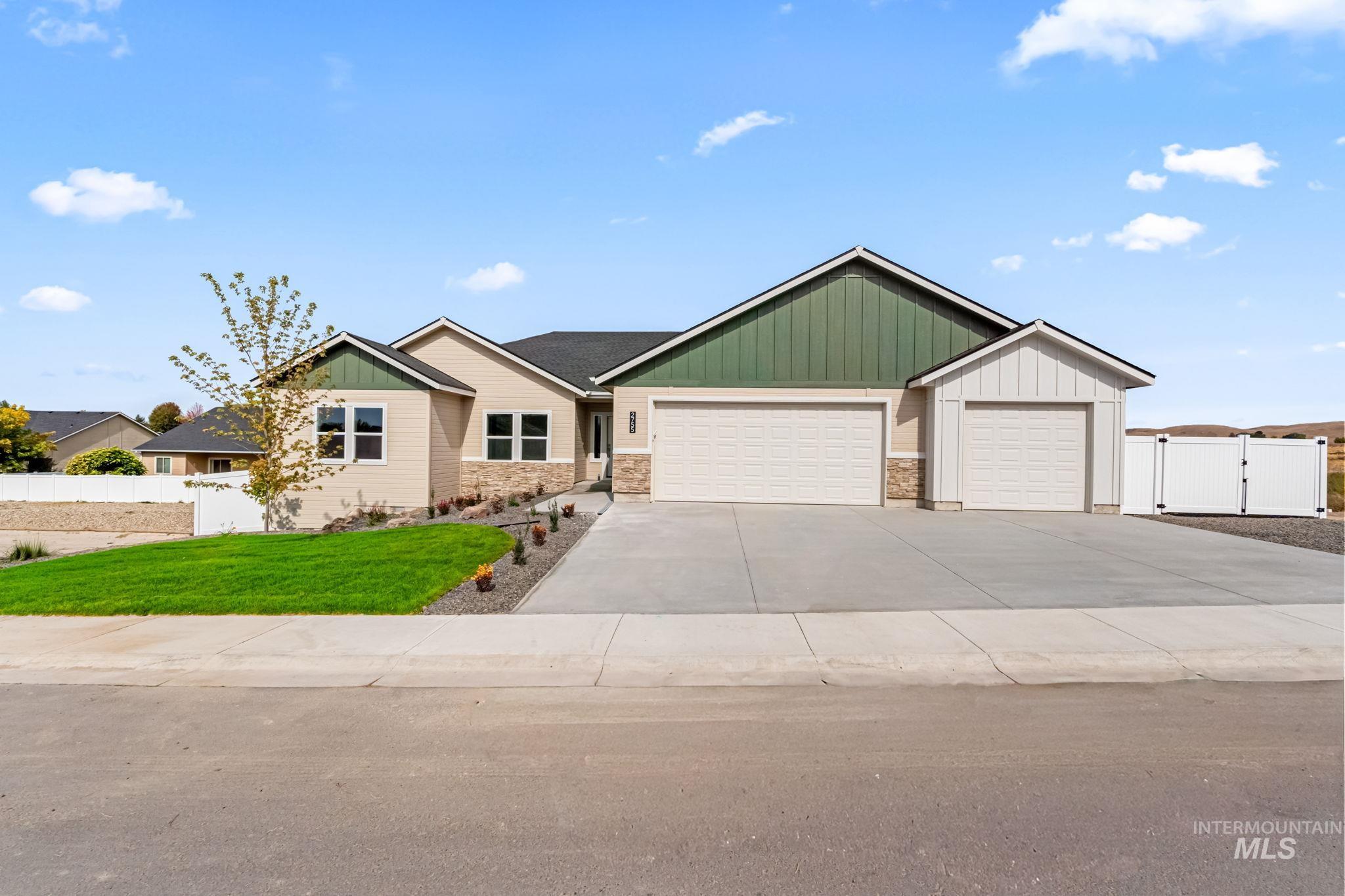 2755 Cypress Point Payette, ID 83661 - Photo 28 of 28 View of front of house featuring a gate, board and batten siding, an attached garage, and concrete driveway