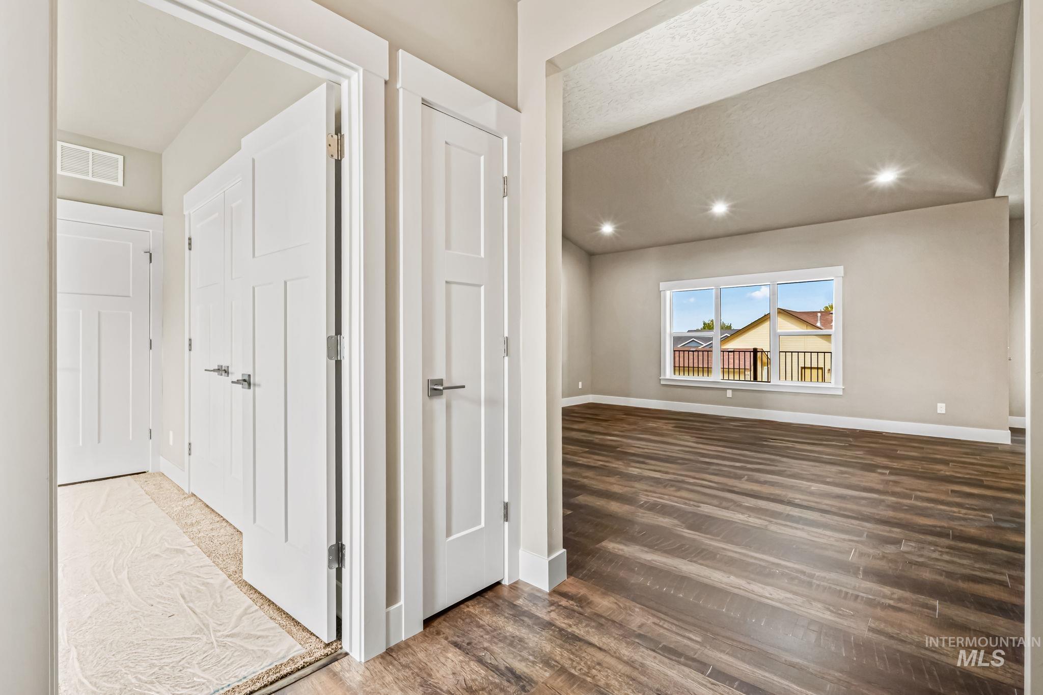 2755 Cypress Point Payette, ID 83661 - Photo 3 of 28 Corridor featuring dark wood-style flooring, a textured ceiling, and recessed lighting