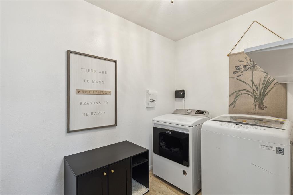 724 Edgehill Drive Hurst, TX 76053 - Photo 12 of 27 a utility room with dryer and washer