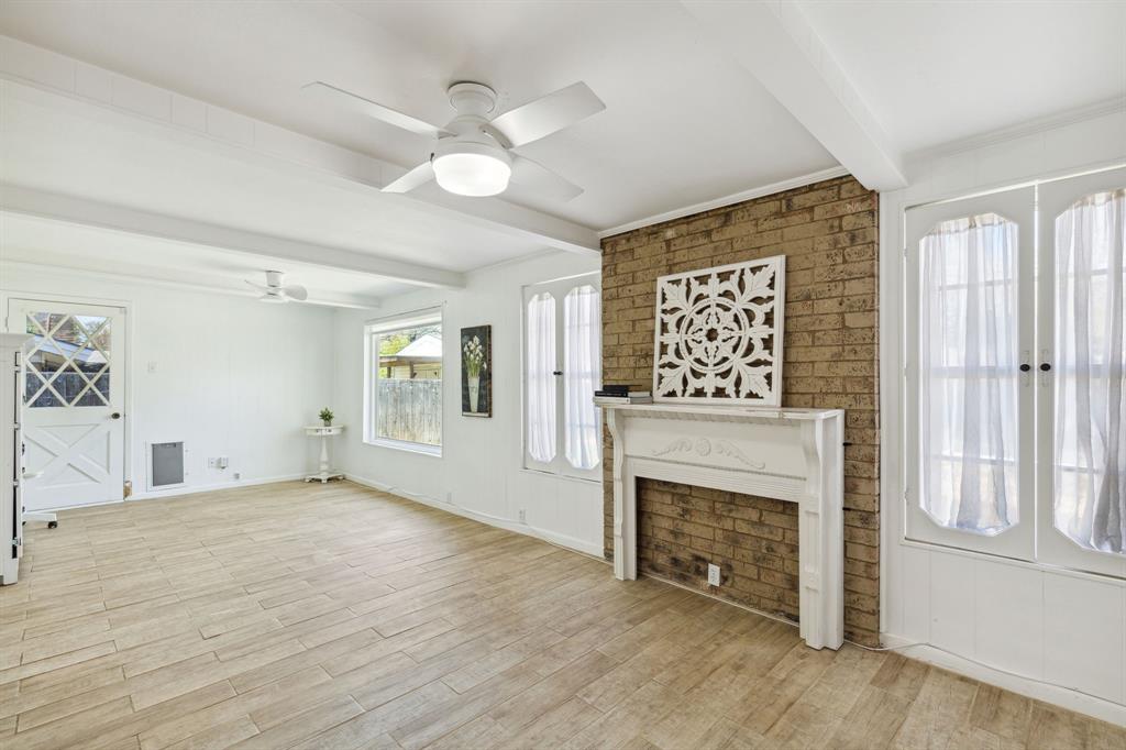 724 Edgehill Drive Hurst, TX 76053 - Photo 13 of 27 a view of an empty room with window and fireplace